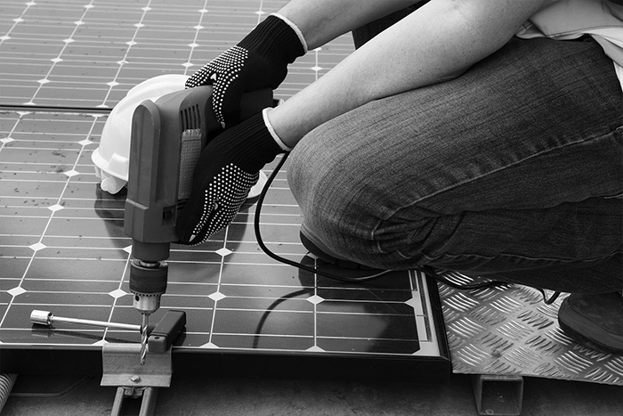 PV Solar Installer Installing Solar Panel