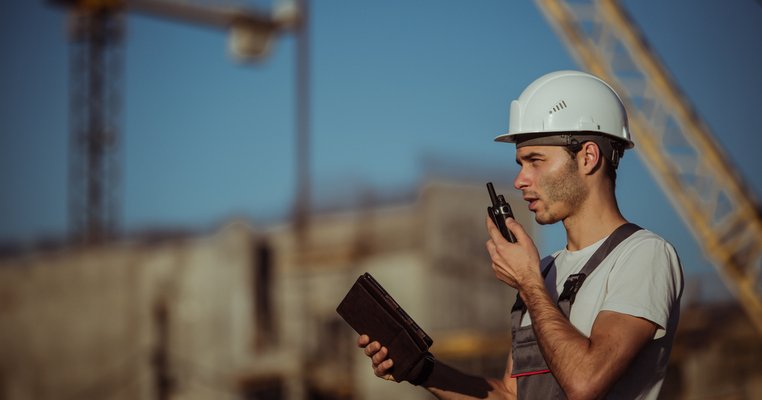 A man working at a construction site who has undergone a training program
