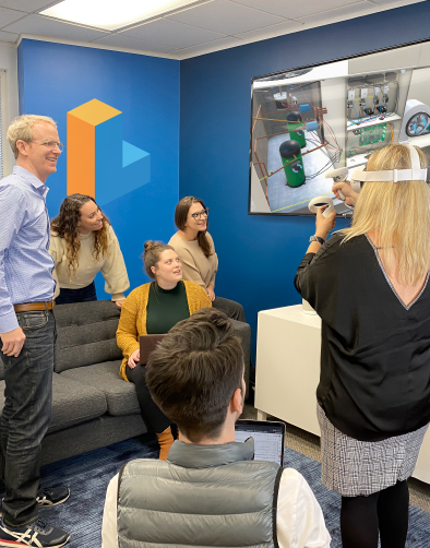 An Austin-based Interplay Learning Center with people standing in a room