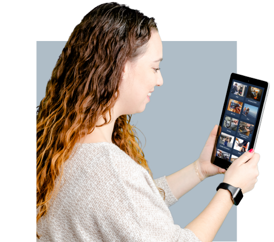 A woman holding a tablet using it for individual skilled trades training