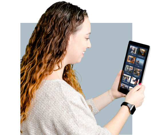 A woman holding a tablet using it for individual skilled trades training