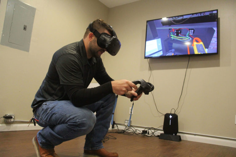 A man learning through virtual reality at Interplay Learning