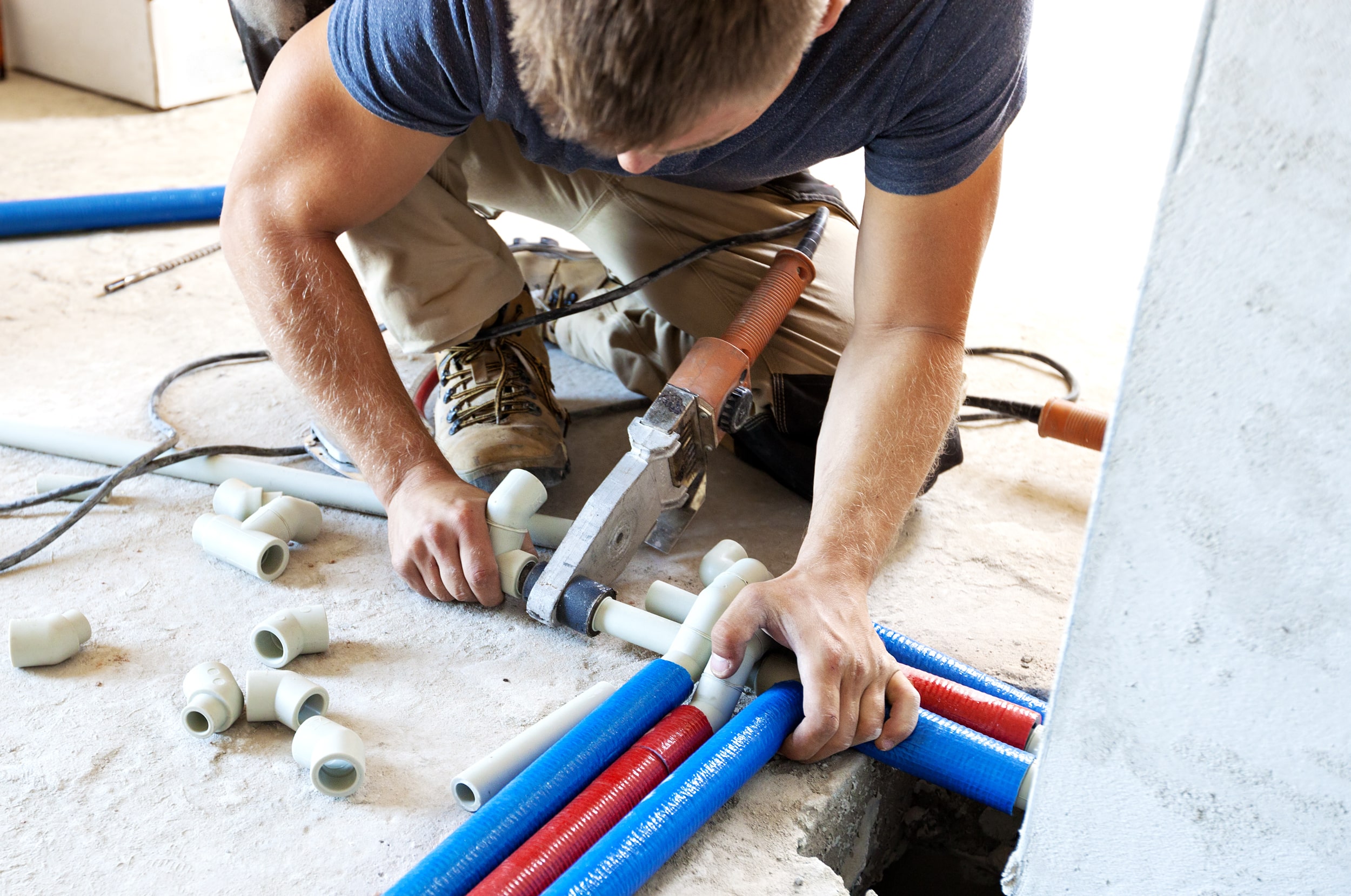 A man working with PVC and CPVC pipes