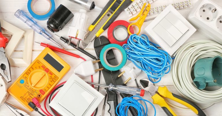 A bunch of electrical tools on a table