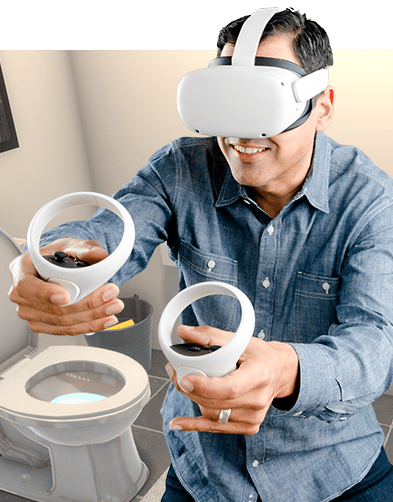 A man in a blue shirt using a VR headset for online plumbing training