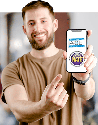 A man holding up a cell phone that shows IACET accreditation and NATE certification