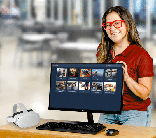 A woman in red glasses using a computer for small business skilled trades training