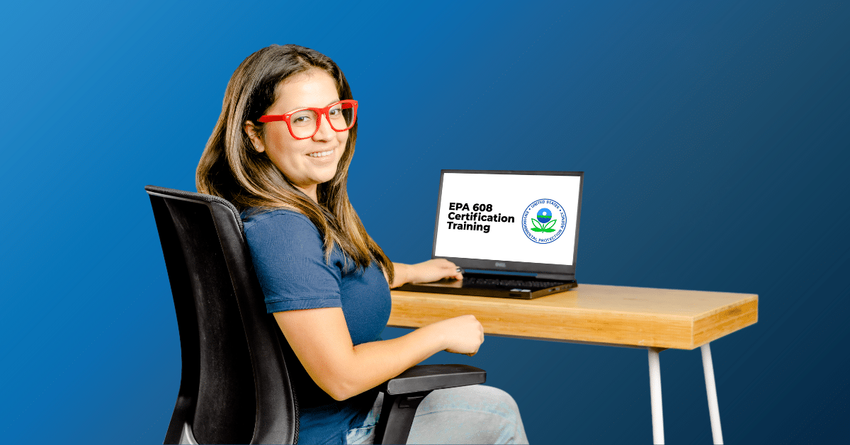 A woman sitting at a desk with a laptop using it for EPA 608 Certification training