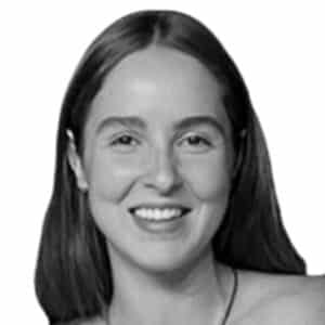 a black and white photo of a woman smiling