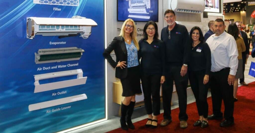 a group of people standing in front of a display