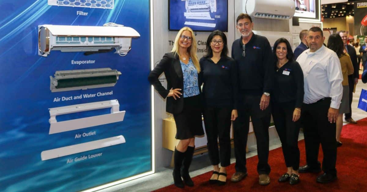 a group of people standing in front of a display