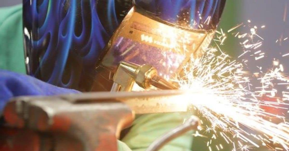 a welder is working on a piece of metal
