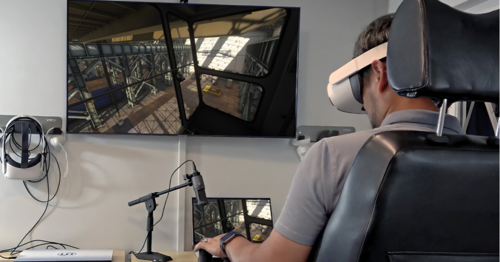 A man sitting in a chair while using Interplay Learning VR Crane simulation training in a training room