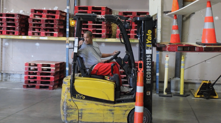man on forklift in warehouse