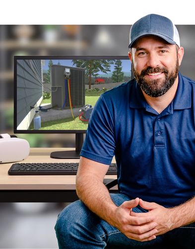 A man sitting in front of a computer monitor displaying Interplay's HVAC training program.